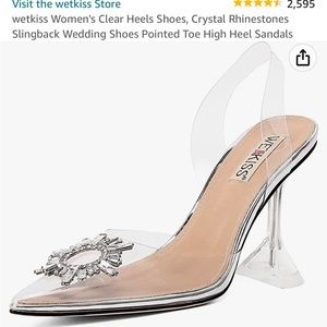 Clear pointed toe heels with crystal detail on the top. brand: Wet Kiss”.